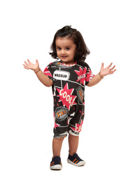 Kid in a Black Printed Jumpsuit